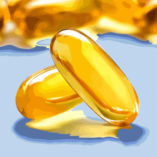 dos cápsulas amarillas de omega-3, apoyadas una encima de la otra y de fondo muchas cápsulas más